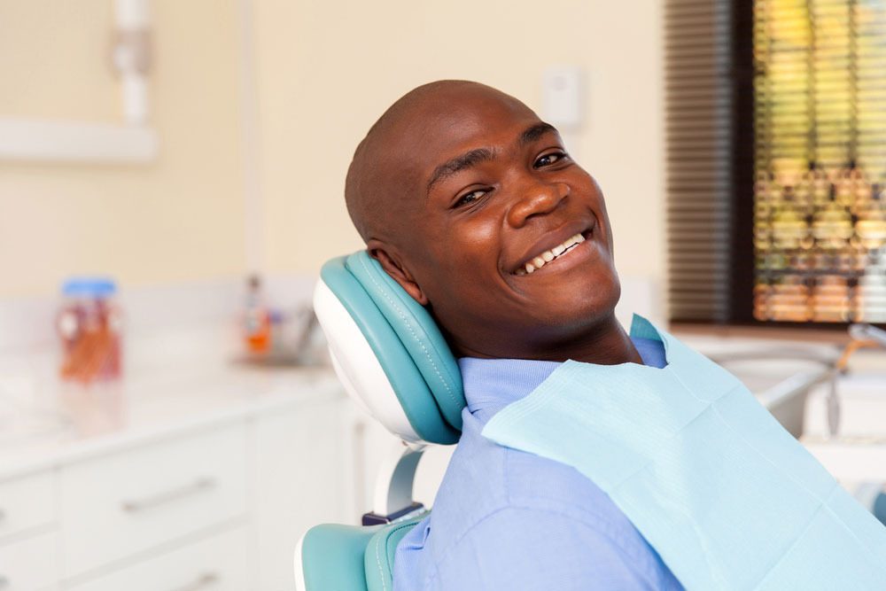 man-in-dental-chair-overcomes-his-dental-anxiety