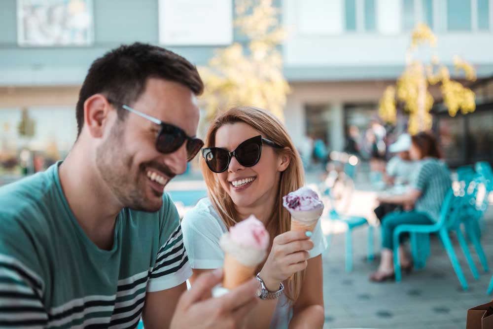couple eating ice cream in the sun